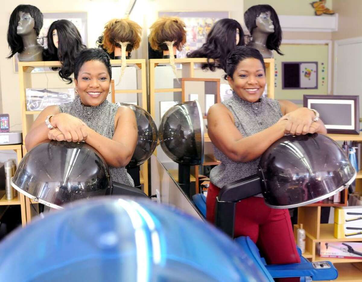 Karaine Holness, owner of Hair's Kay Academy of Cosmetology on Fitch Street in New Haven, Connecticut March 13, 2013, a new not-for-profit cosmetology school. Holness wants to creat jobs and opportunity in her community. Photo by Peter Hvizdak / New Haven Register