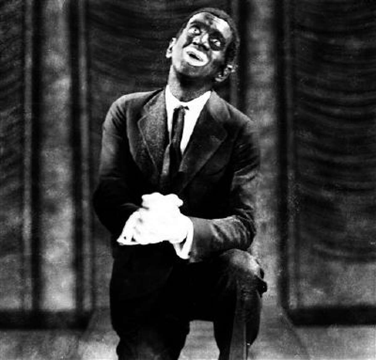 This 1927 image originally released by Warner Bros., shows Al Jolson in blackface makeup in the movie "The Jazz Singer." Historically, blackface emerged in the mid-19th century, representing a combination of put-down, fear and morbid fascination with black culture. Among the most prominent examples: Al Jolson and Eddie Cantor. Today, there?s a fine line between mockery and tribute.