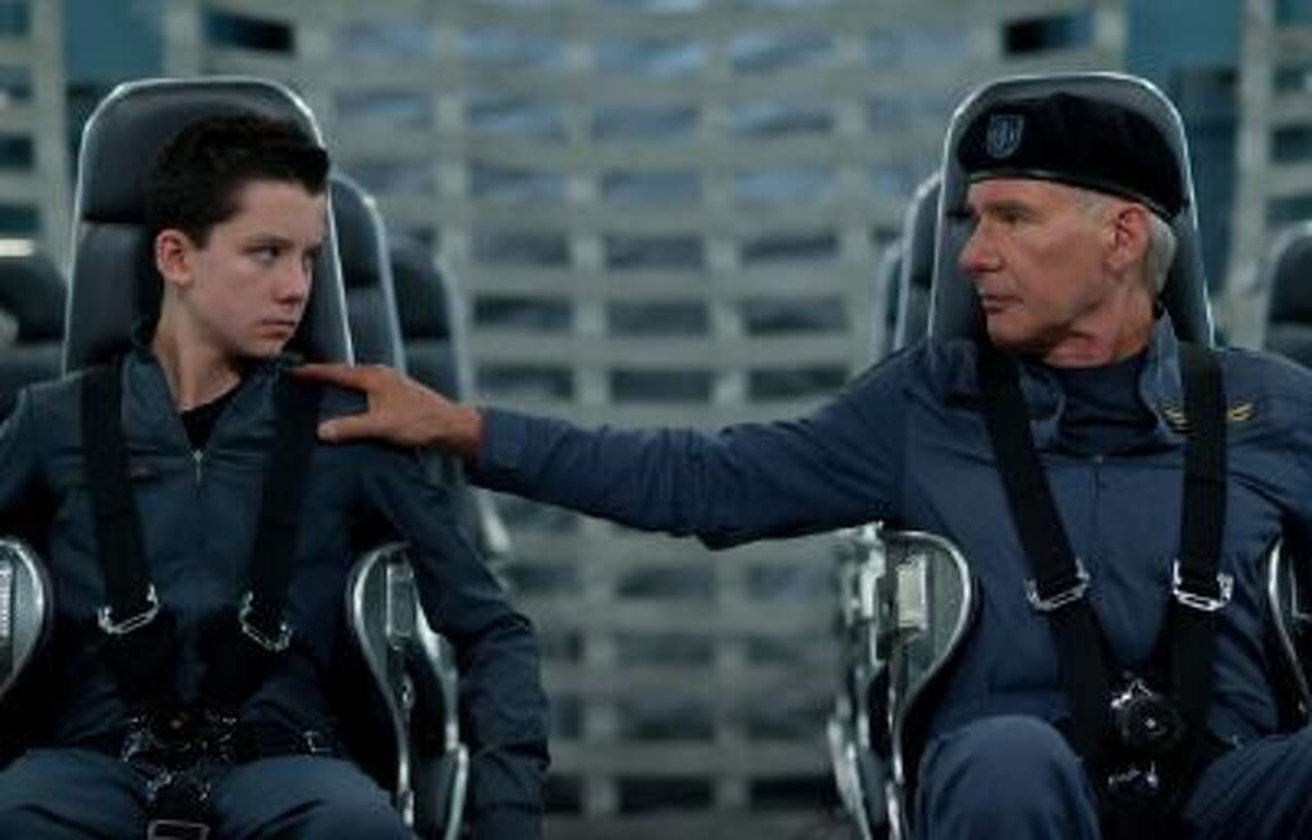 Asa Butterfield, left, and Harrison Ford in a scene from "Ender's Game."