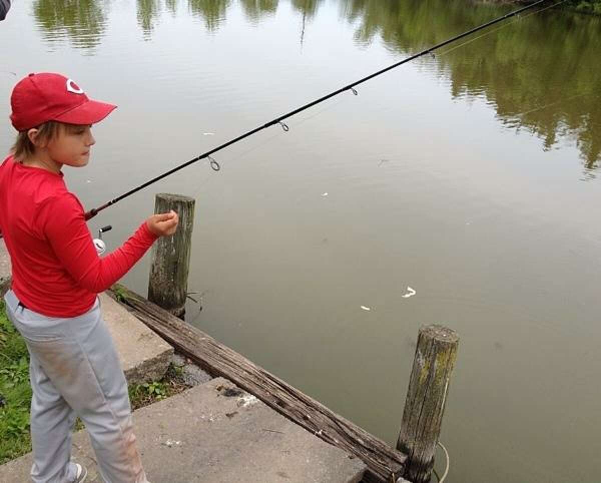 PHOTO BY JOHN HAEGER @ ONEIDAPHOTO ON TWITTER/ONEIDA DAILY DISPATCH Shane Plack ,10, of Canastota tests his skills during the annual fishing derby in Sherrill on Saturday, May 18, 2013.