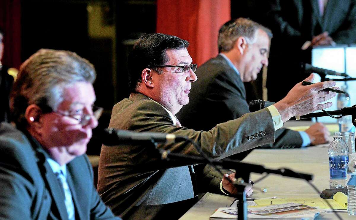 (Peter Casolino — New Haven Register) Democrat candidate Edward O'brien makes a point during the West Haven Mayoral debate at Carrigan Intermediate School on Tuesday night. On the left is Republican candidate Bart Chadderton, and on the right is Mayor (and write-in candidate) John M. Picard. pcasolino@NewHavenRegister