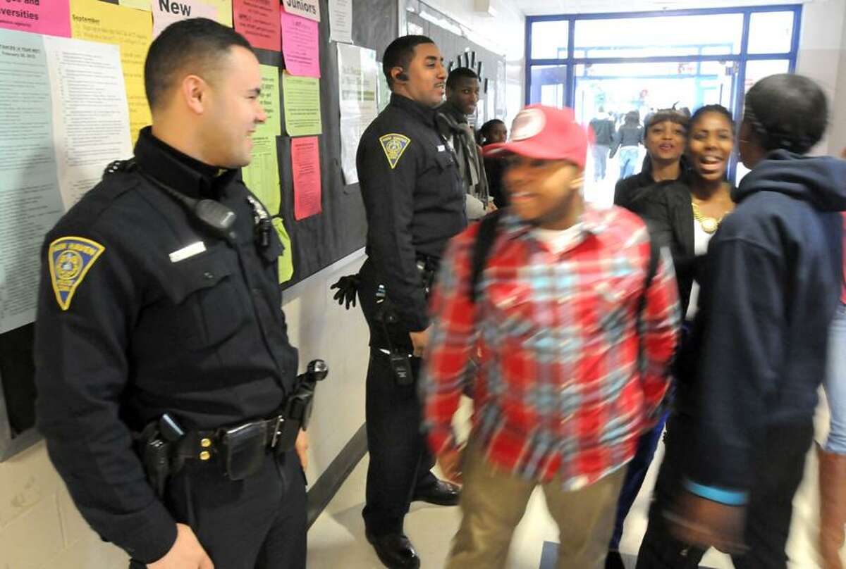 Two New Haven police officers, Martin Feliciano left and James Baker right, are assigned to Hillhouse High School as school resource officers. Mara Lavitt/New Haven Register3/15/13
