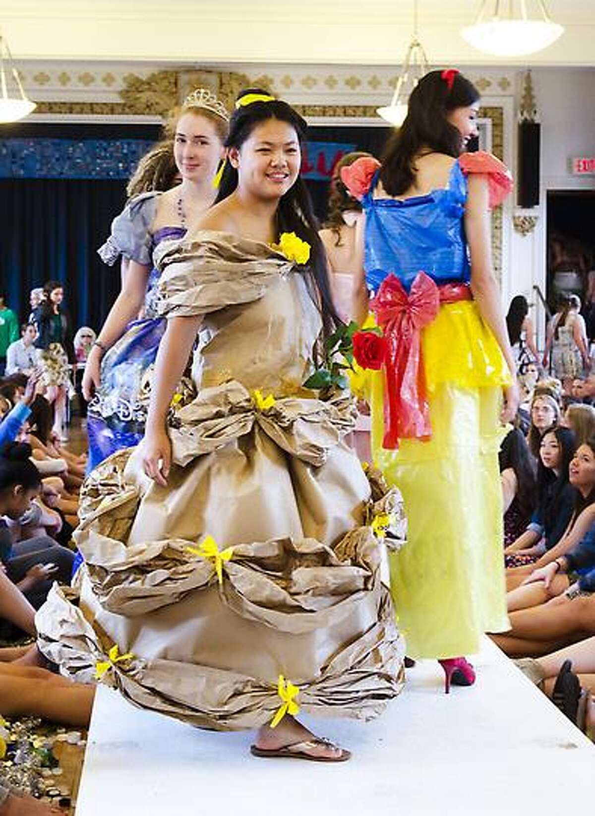 Lauralton Hall students model clothing made from recycled materials at an eco-fashion show in Milford. Melanie Stengel/Register