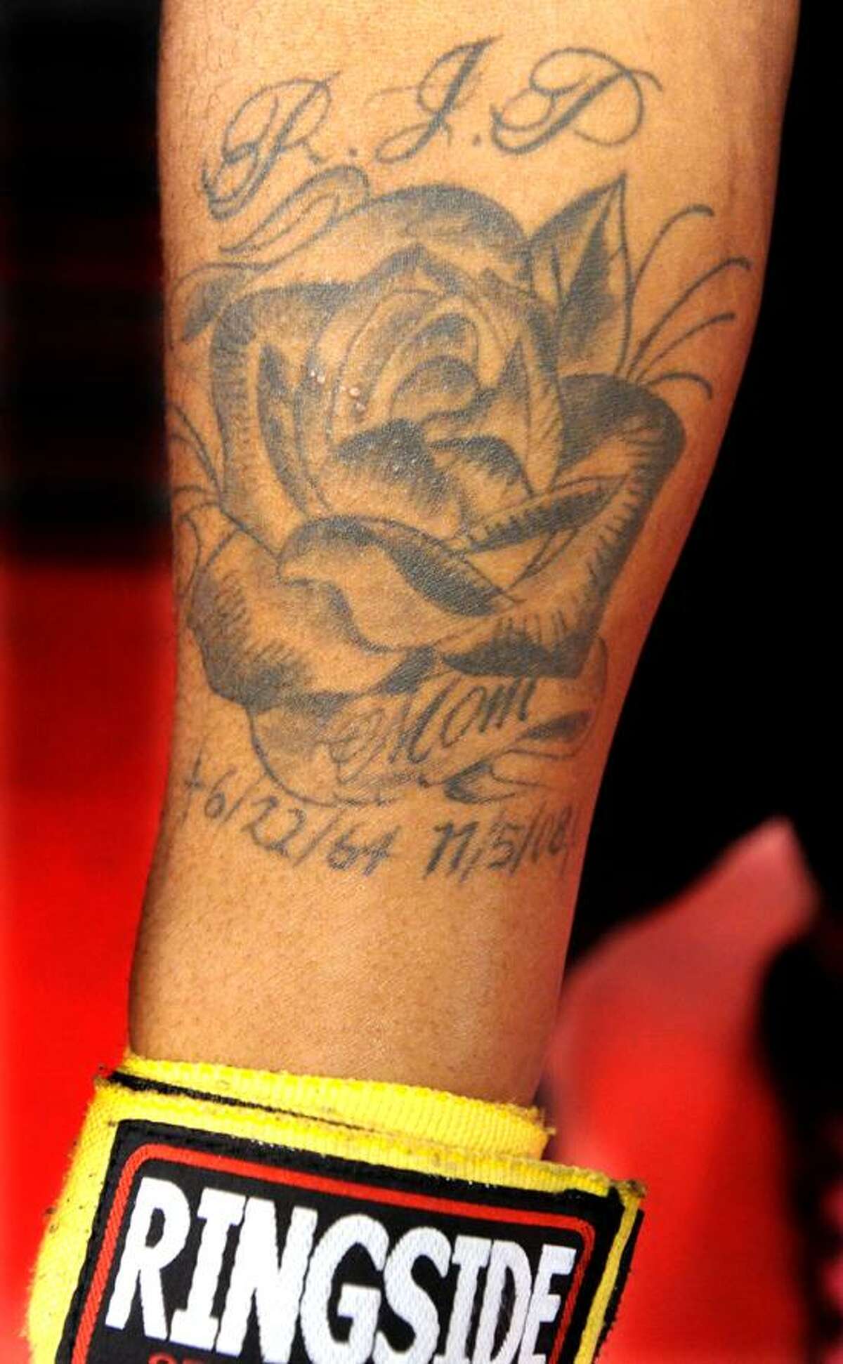 Boxer Jimmy Williams of West Haven at New Haven Boxing in North Haven. The tatoo memorializes his slain mother Belinda Jordan Williams, murdered in NJ in 2008. Mara Lavitt/New Haven Register1/15/13