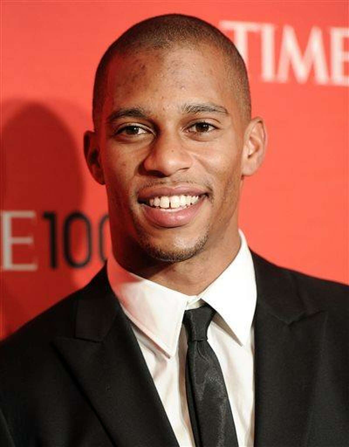 File-This April 24, 2012 file photo shows New York Giants football player Victor Cruz attending the TIME 100 gala, celebrating the 100 most influential people in the world, at the Frederick P. Rose Hall in New York. Cruz has signed a five-year contract extension that runs through the 2018 season. The deal with worth $43 million according to media reports Monday July 8, 2013. Cruz was a restricted free agent with three years in the NFL. Last month, he signed a one-year, $2.879 million tender with the Giants, but a long-term deal was already in the works. The Giants could have matched any offers Cruz received from other teams, so he didn't get any. (AP Photo/Evan Agostini,File)