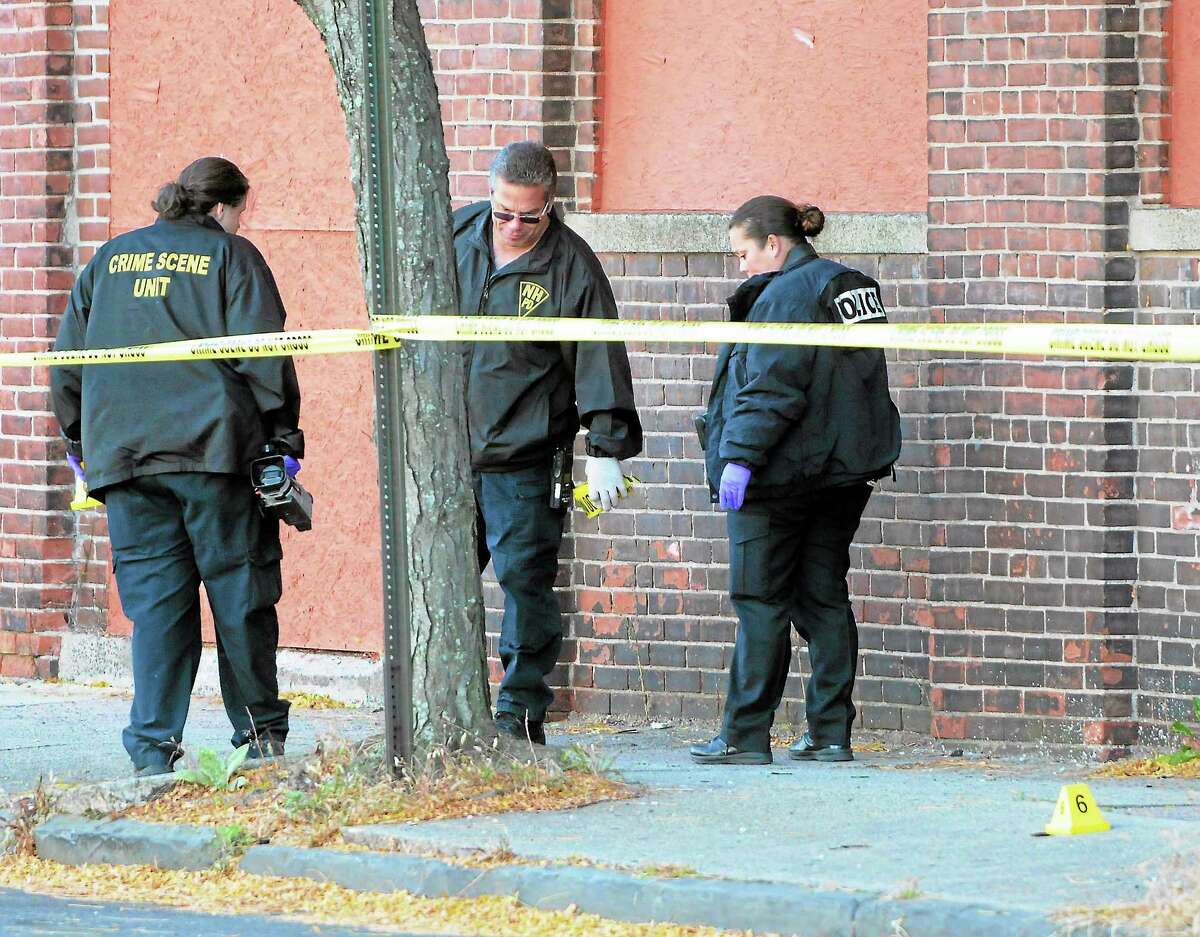 (Peter Hvizdak — Register)Saturday October 26, 2013(Peter Hvizdak — Register)New Haven Police investigate the crime scene where one woman is dead, two people are listed in critical condition and three are being treated for non-life threatening wounds and injuries after a shooting at the Key Club Cabaret at 85 Saint John St. near Hamilton St. Saturday morning October 26, 2013.