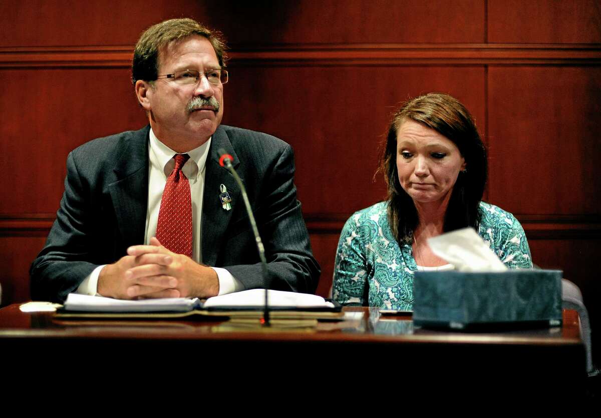 Bill Sherlach, left, husband of Sandy Hook Elementary School shooting victim Mary Sherlach, and Nicole Hockley, mother of victim Dylan Hockley, speak before the Task Force on Victim Privacy and the Publics Right To Know, Wednesday, Oct. 30, 2013, in Hartford, Conn. Sherlach and Hockley told the panel they don't want the 911 tapes from that day released to the public. The Freedom of Information Commission has ordered the release of the 911 recordings, but a prosecutor has said the ruling will be appealed. (AP Photo/Jessica Hill)