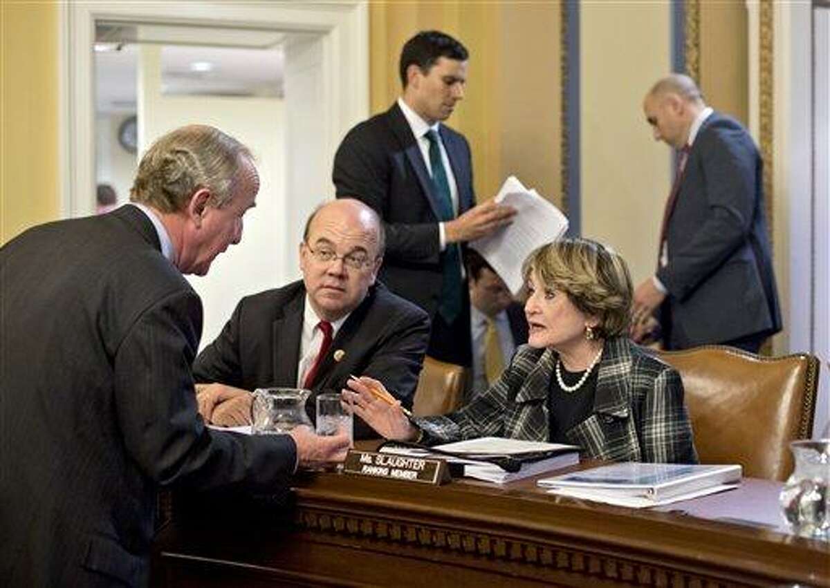 Rep. Rodney Frelinghuysen, R-N.J., left, confers with Rep. Louise Slaughter, D-N.Y., Rep. Jim McGovern, D-Mass., center, as the House Rules Committee sorts through dozens of amendments on an aid package to assist victims of Superstorm Sandy that devastated parts of the Northeast coast in October, at the Capitol in Washington, Monday, Jan. 14, 2013. The House is expected to vote on the bill Tuesday. (AP Photo/J. Scott Applewhite)
