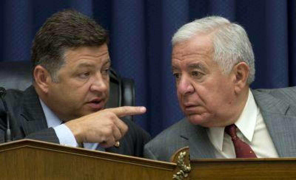 House Transportation and Infrastructure Full Committee Chairman Rep. Bill Shuster, R-Pa., left, talks to the committee's ranking Democrat Rep. Nick Rahall, D-W.Va. on Capitol Hill in Washington, Thursday, May 16, 2013, during the committee's markup to consider legislation on the Keystone XL pipeline project and other measures. (AP Photo/Carolyn Kaster)