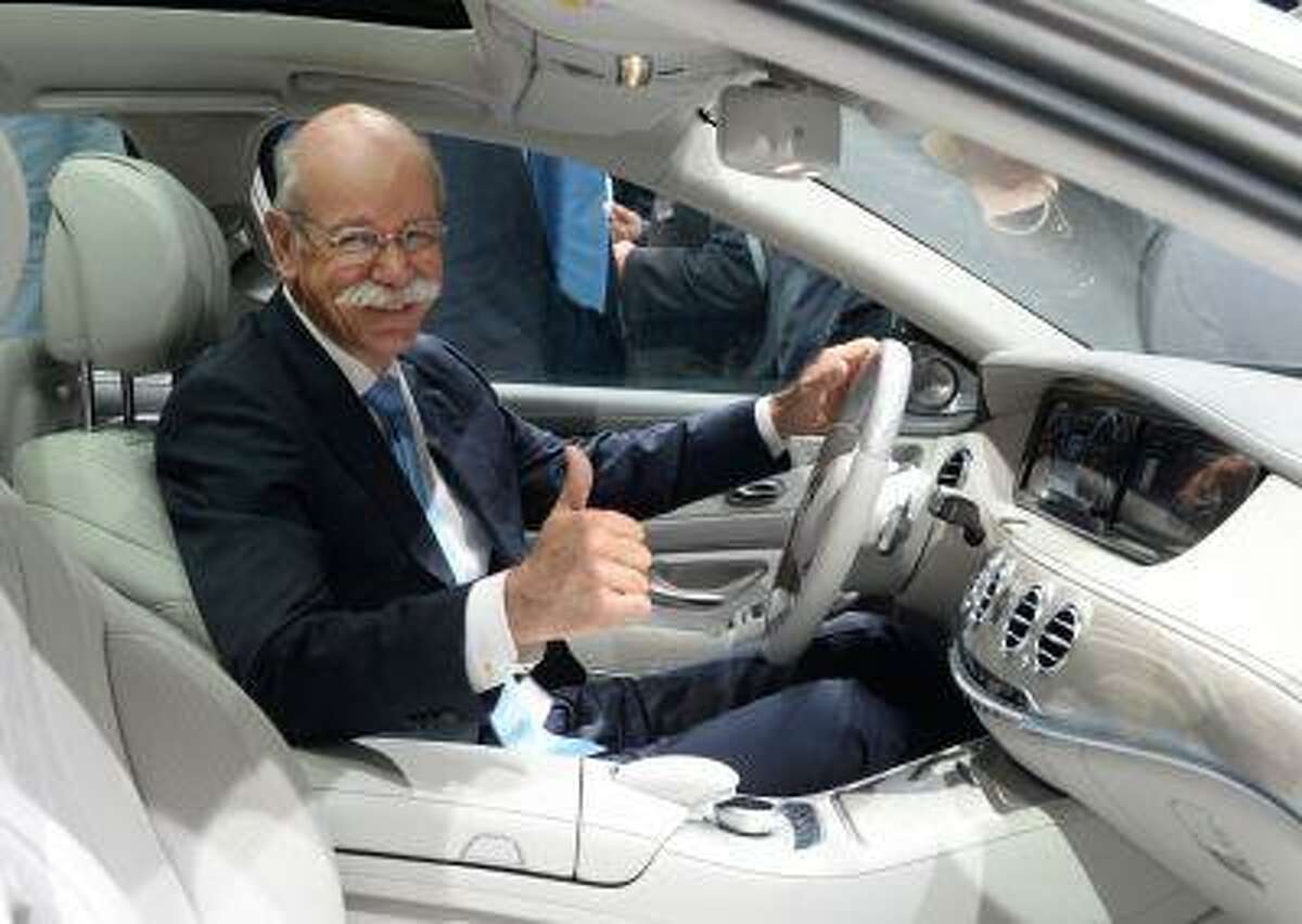 CEO of Daimler Dieter Zetsche sits in the new S-Class Mercedes presented in Hamburg, Germany, Wednesday, May 15, 2013. The new Mercedes is supposed to have lower fuel consumption and high security standards due to driving assistance.. (AP Photo/dpa/Marcus Brandt)