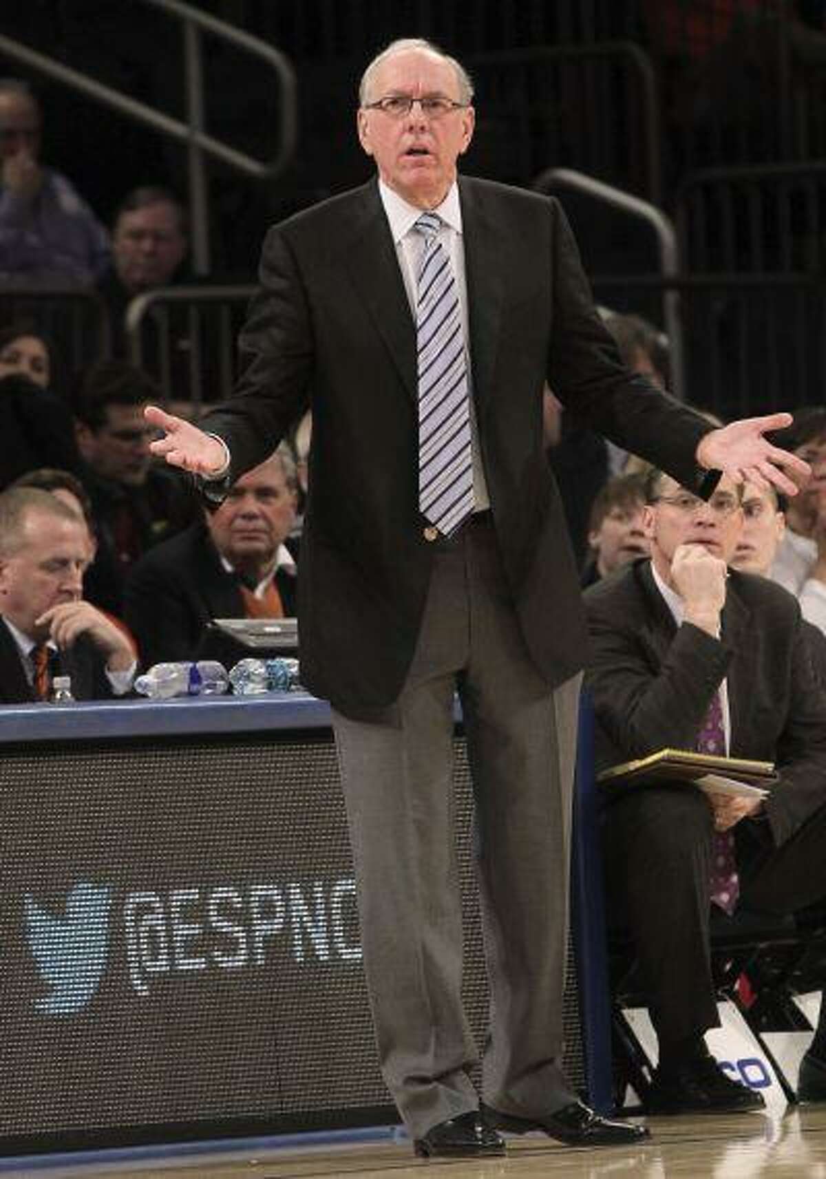 Syracuse head coach Jim Boeheim gestures during the first half of an game against Seton Hall at the Big East Conference tournament, in New York, March 13, 2013.