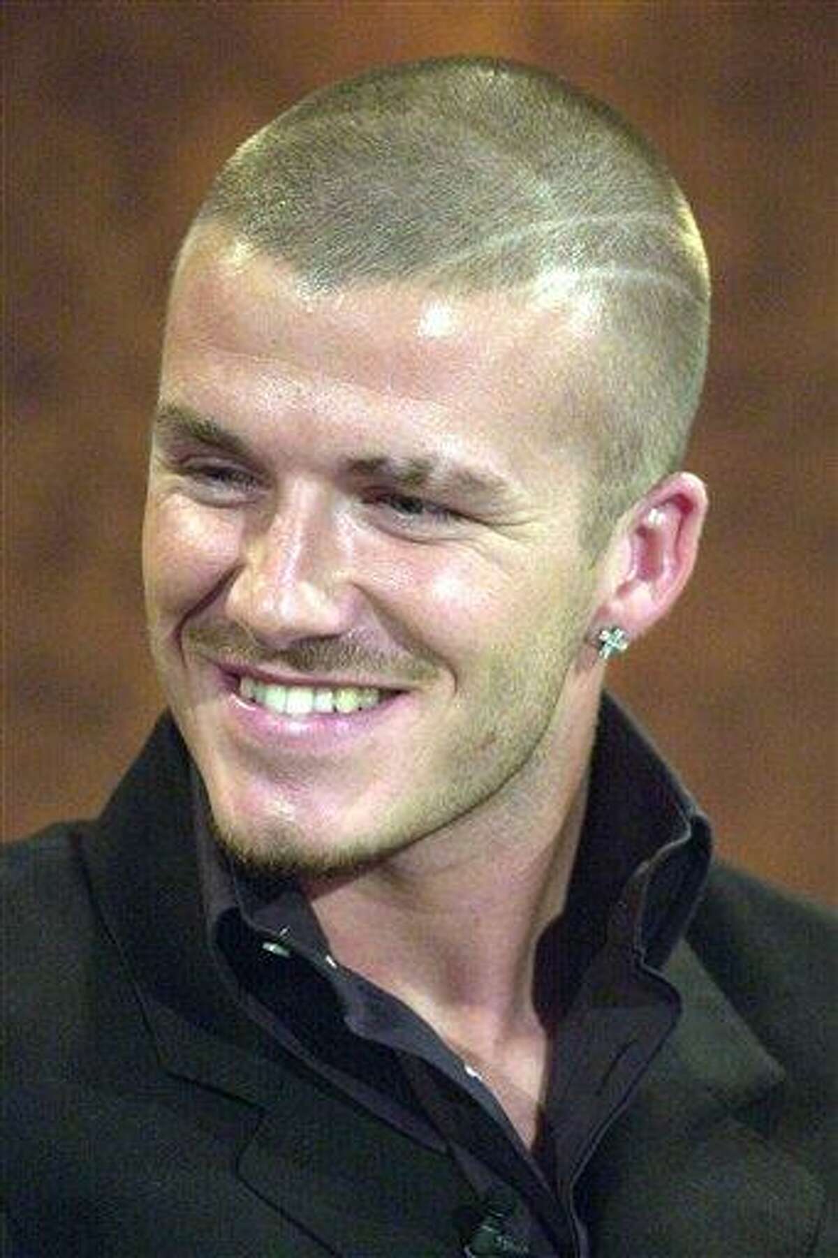 FILE - This is a Oct. 13, 2001 file photo of Soccer player David Beckham during an episode of the German television show in Erfurt, Germany. David Beckham is retiring from soccer after the season, ending a career in which he become a global superstar since starting his career at Manchester United. The 38-year-old Englishman recently won a league title in a fourth country with Paris Saint-Germain. He said in a statement Thursday May 16, 2013 he is "thankful to PSG for giving me the opportunity to continue but I feel now is the right time to finish my career, playing at the highest level." (AP File Photo/Jens Meyer)