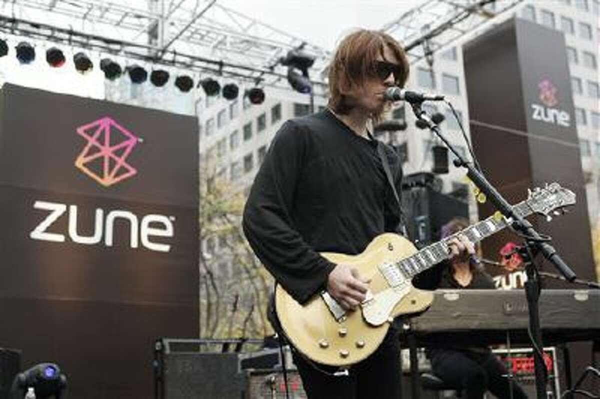 In this Nov. 13, 2006 file photo, Benjamin Curtis with the band Secret Machines performs at a launch party for Microsoft's new music player Zune at Westlake Park in downtown Seattle. Curtis, guitarist and co-founder of the popular indie-rock band School of Seven Bells, has died on Dec. 29, 2013, of cancer. He was 35.