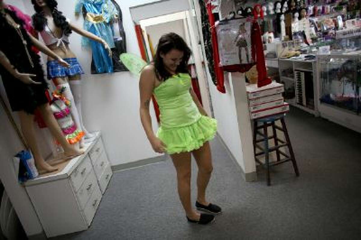 Sarah Helton puts together a Halloween costume at Dixon Costumes, Inc on October 23, 2013 in Miami, Florida.