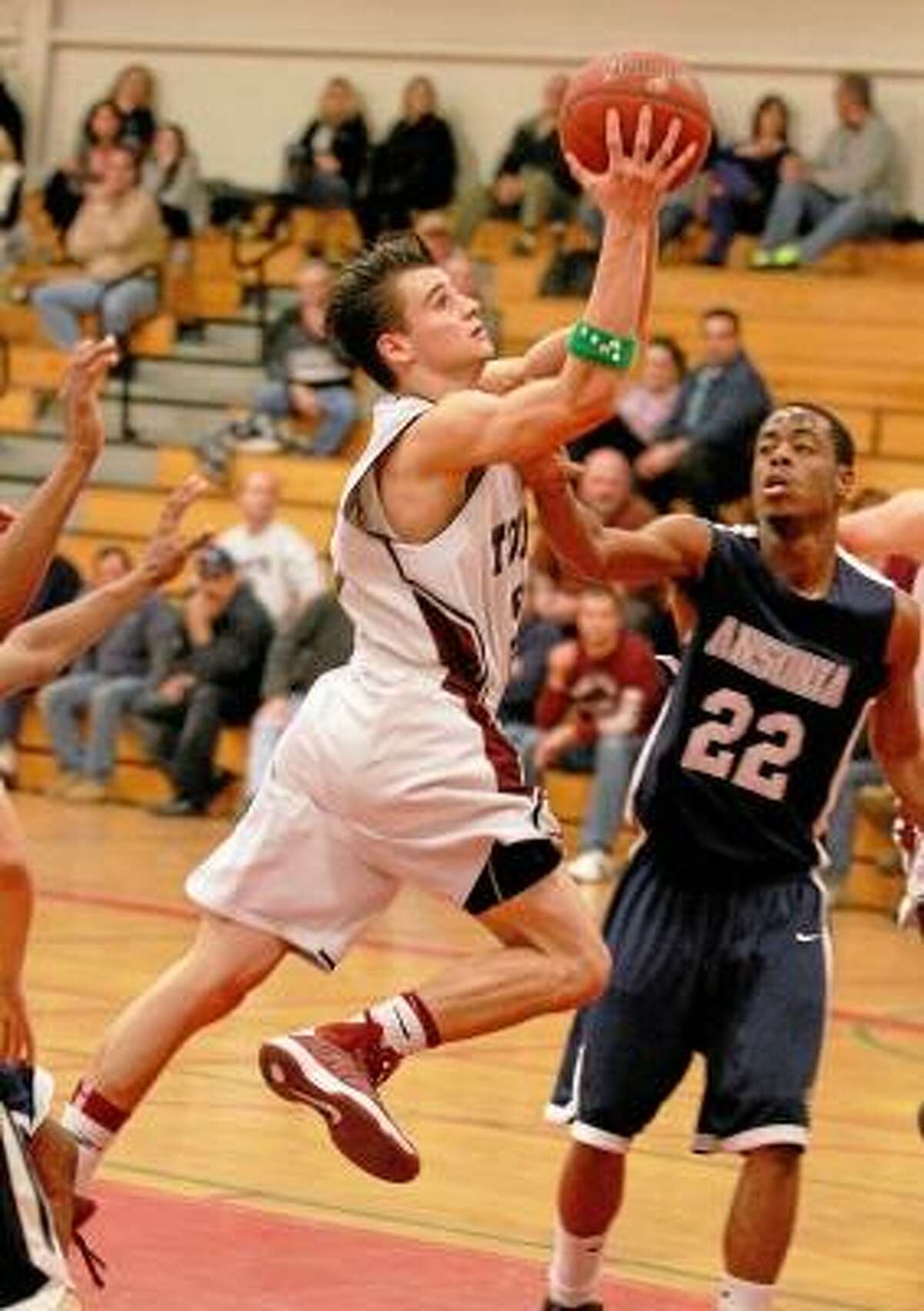 Torrington's Austin Kelson drives to the basket against Ansonia. Photo by Marianne Killackey/Special to Register Citizen