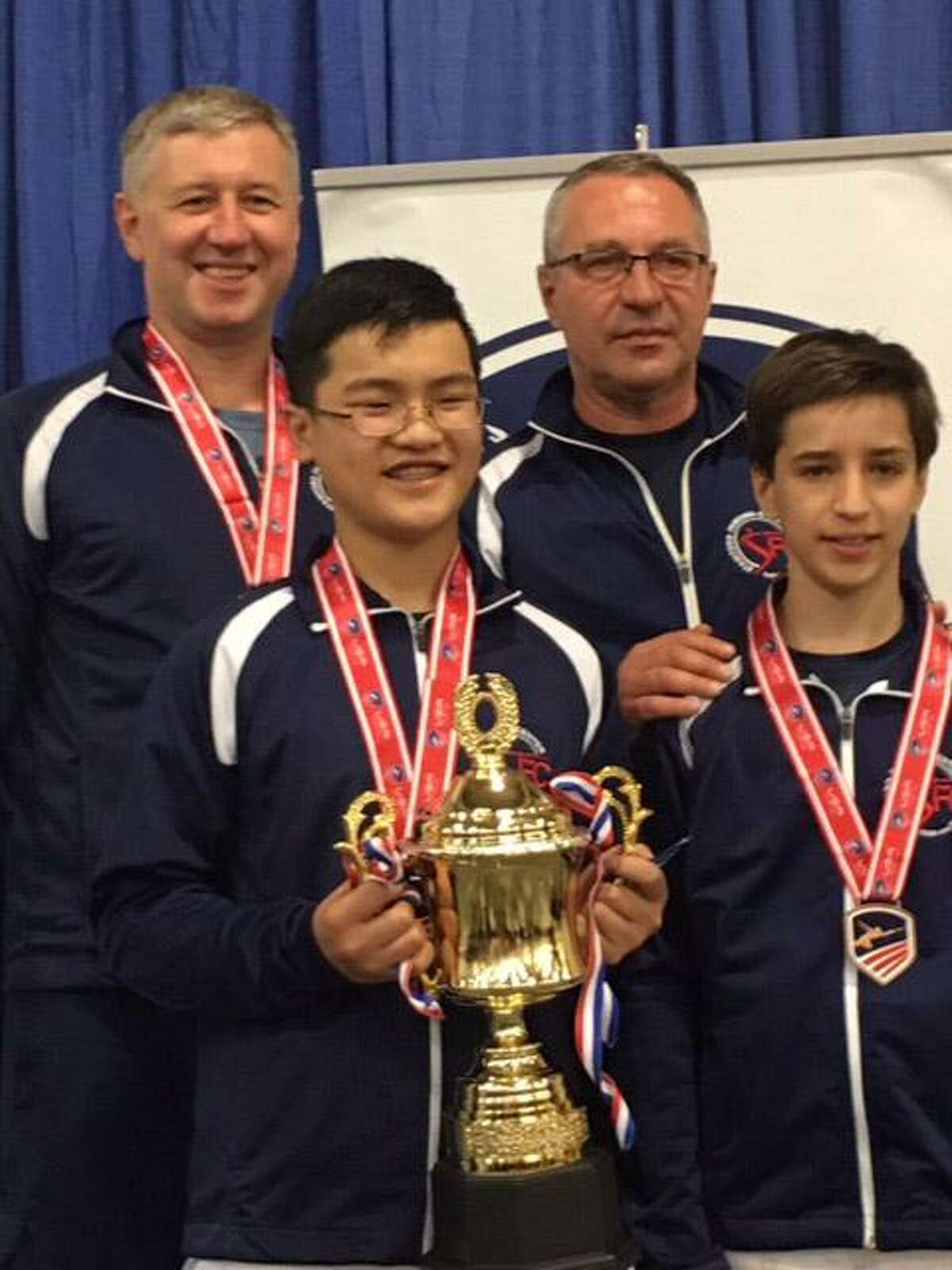 John Lin front row left, a Brunswick School student, and Nicky Wind gather at the 2017 National Fencing Championships held at Salt Lake City, Utah. Lin won the first-place medal in the sabre event, while Wind finished eighth. Pictured with them are coaches Alex Fotiyev, back row left, and Oleg Tretyak.
