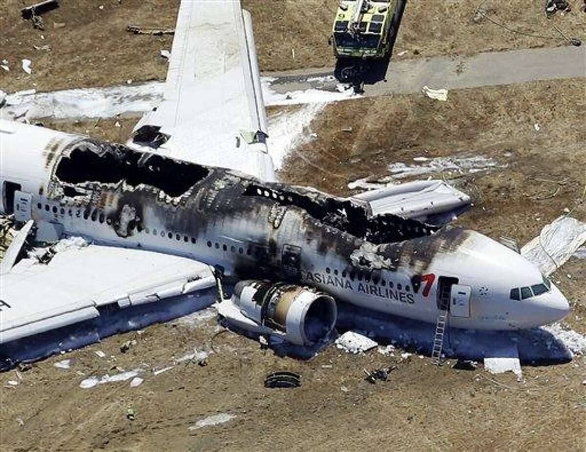 This aerial photo shows the wreckage of the Asiana Flight 214 airplane after it crashed at the San Francisco International Airport in San Francisco, Saturday, July 6, 2013. (AP Photo/Marcio Jose Sanchez)