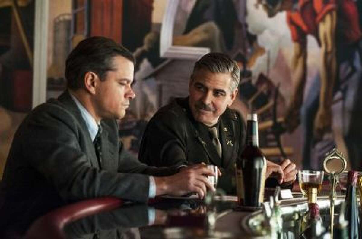 This film image released by Columbia Pictures shows Matt Damon, left, and George Clooney in "The Monuments Men."