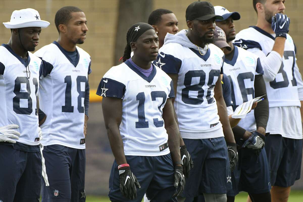 Dallas Cowboys wide receiver Lucky Whitehead (13) stands with fellow receivers during practice at the NFL football team's training camp in Oxnard, Calif., Monday, July 24, 2017. (AP Photo/Michael Owen Baker)