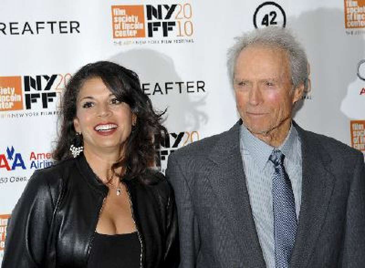 In this Oct. 10, 2010 file photo, director and producer Clint Eastwood, right, and wife Dina Eastwood attend the premiere of "Hereafter" at Alice Tully Hall during the 48th New York Film Festival, in New York.