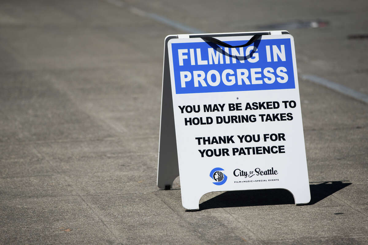 A city-issued sign warns of filming as the Grey's Anatomy crew films on the waterfront, Tuesday, July 25, 2017.