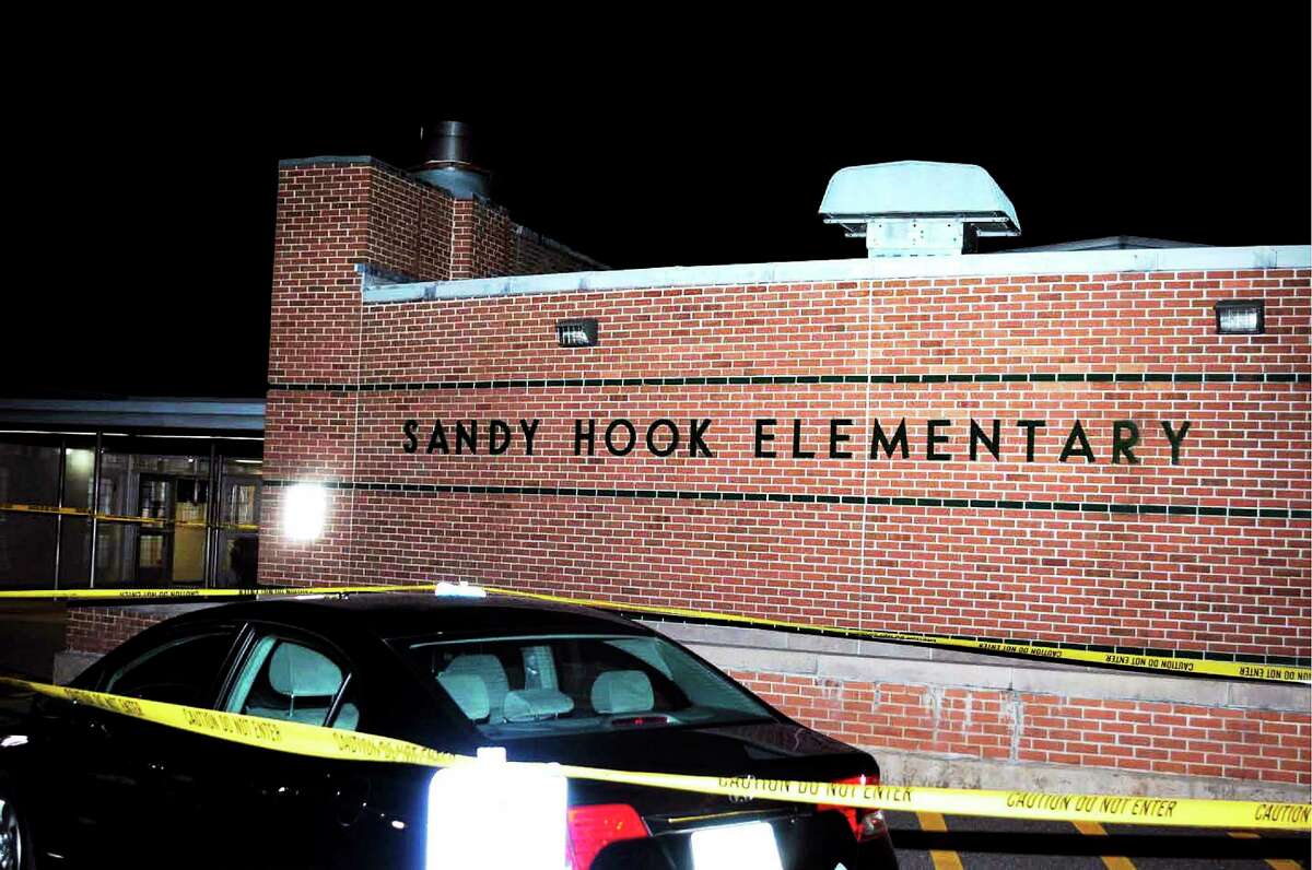 The car driven by Adam Lanza outside the front entrance to Sandy Hook Elementary School, in this photo supplied by the Connecticut State Police.