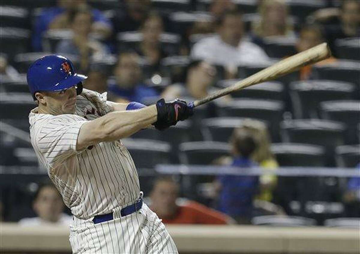 New York Mets' David Wright (5) follows through on a ground-rule double during the eighth inning of a baseball game against the Arizona Diamondbacks Wednesday, July 3, 2013, in New York. (AP Photo/Frank Franklin II)