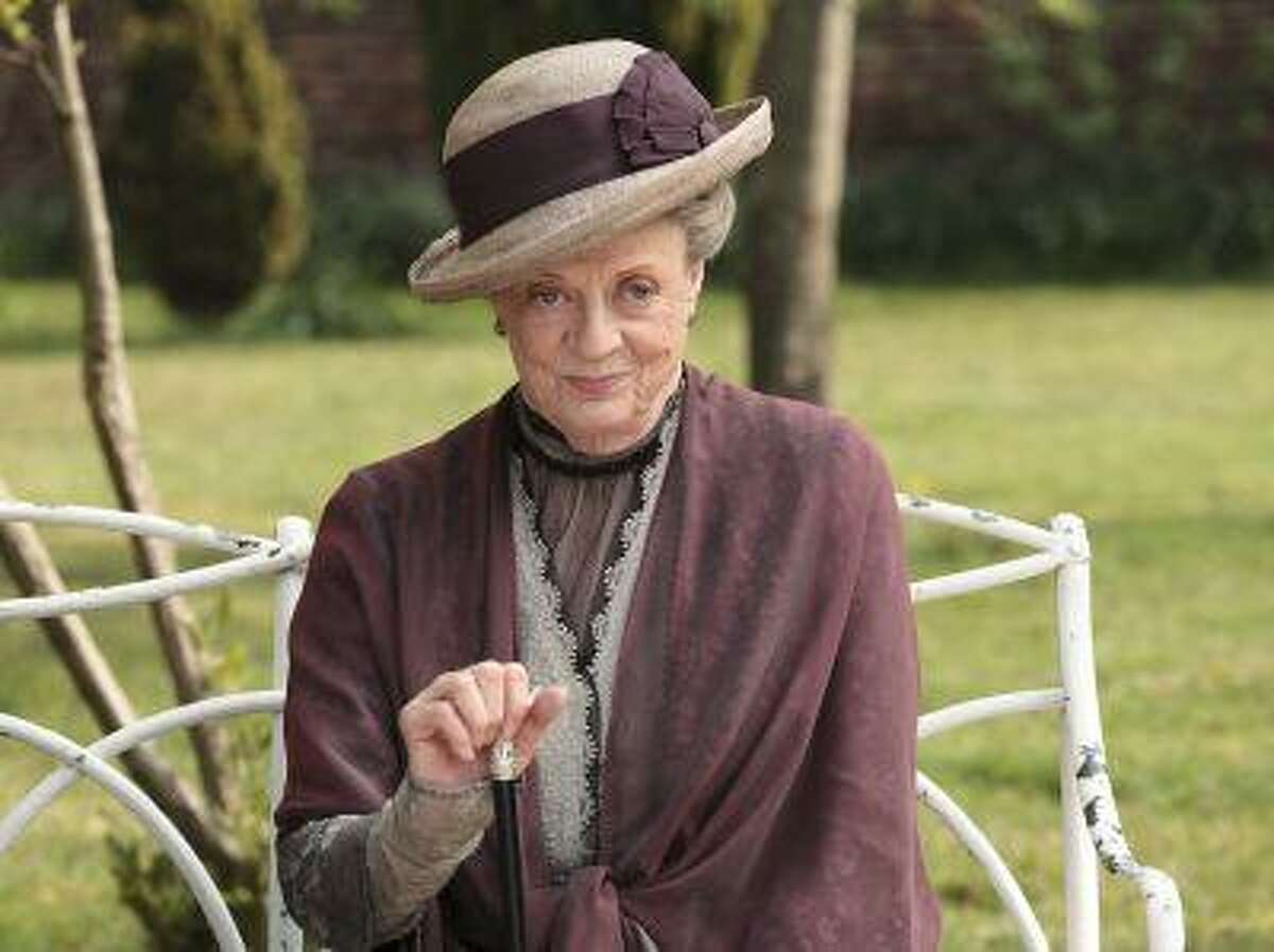 FILE - In this image released by PBS, Maggie Smith as the Dowager Countess Grantham, is shown in a scene from the second season on "Downton Abbey." The fourth season of the popular British series will premiere in the U.S. on Jan. 5, 2014. (AP Photo/PBS, Carnival Film & Television Limited 2011 for MASTERPIECE, Nick Briggs)