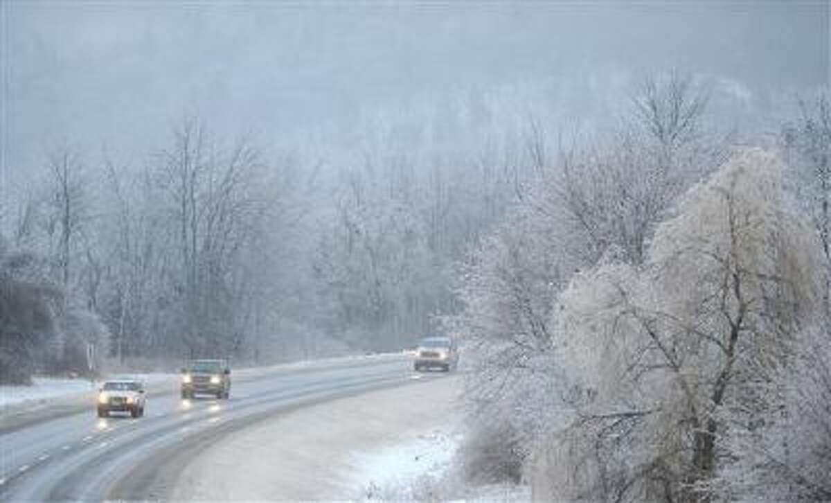 Traffic creeps down Interstate 95 in Waterville, Maine, on Monday. A cold storm is freezing much of the nation.