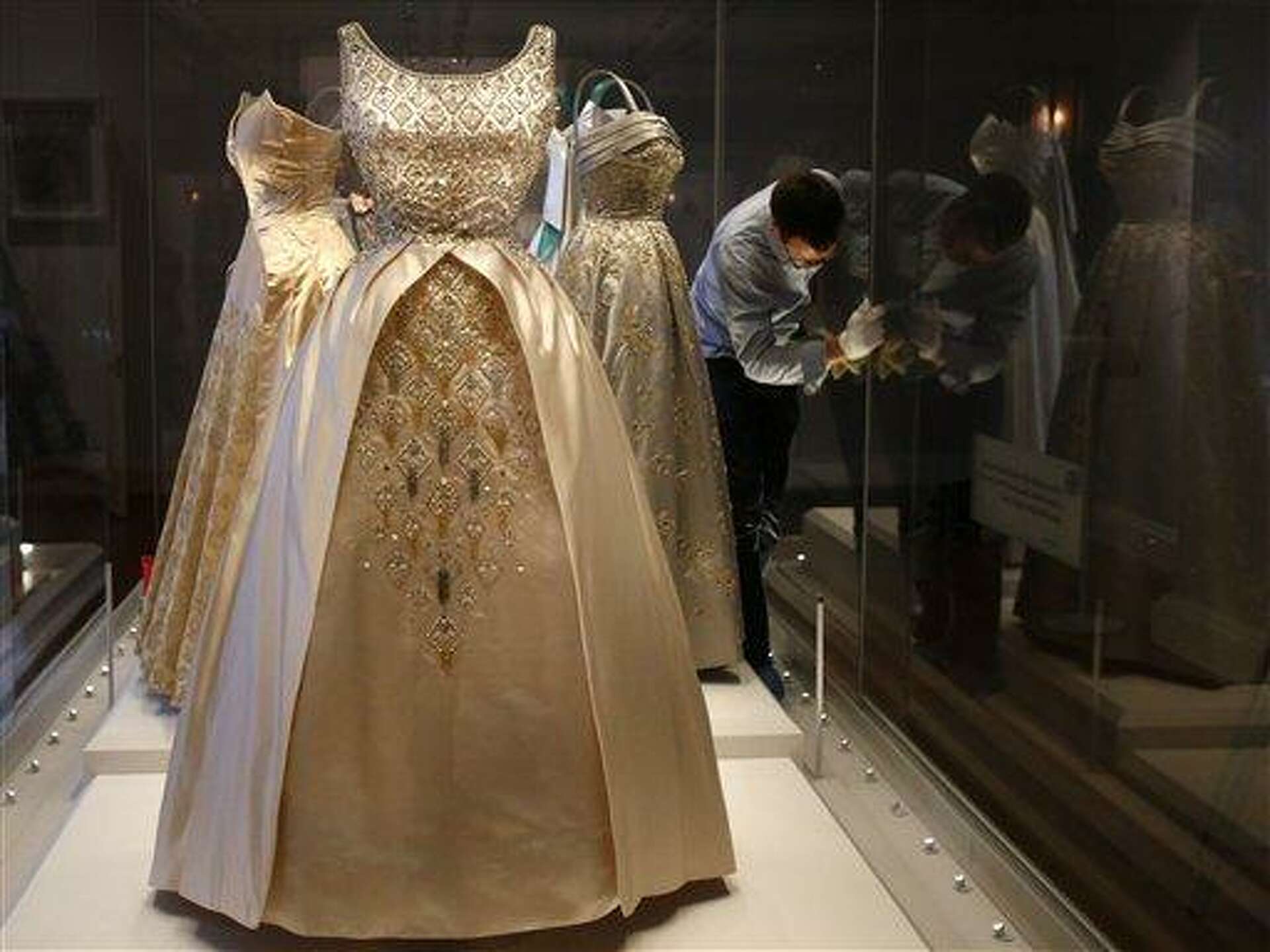 Royal dresses on display in London; they influenced fashion in Britain,  beyond