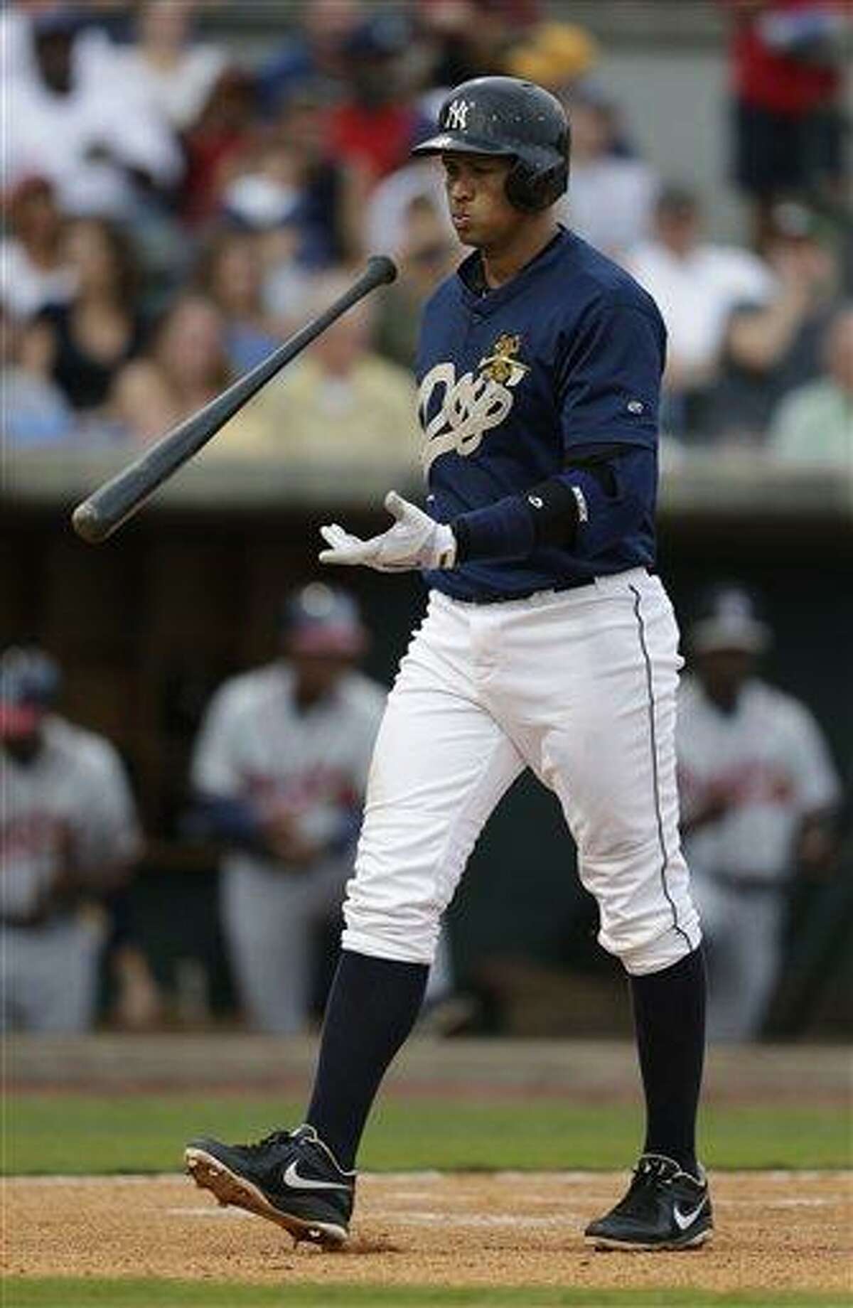New York Yankees' Alex Rodriguez reacts to being called out on strikes during the third inning in his first rehab game with the Charleston RiverDogs in Charleston, S.C., Tuesday, July 2, 2013. (AP Photo/Chuck Burton)