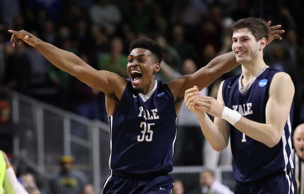 Yale’s Brandon Sherrod, left, and Anthony Dallier celebrate defeating the Baylor Bears 79-75 during the first round of the 2016 NCAA men’s basketball tournament on March 17, 2016, at Dunkin' Donuts Center in Providence, R.I.