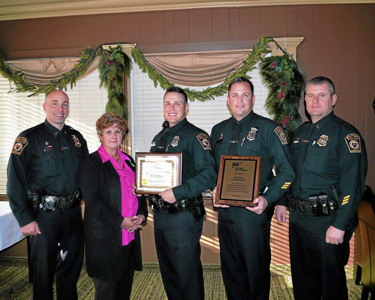 At AAA’s Fourth Annual Community Traffic Safety Awards lunch, Public Affairs Manager Fran Mayko, second from left, presented a Traffic Safety Hero Award to Officer Mauro, third from left. Also attending the event were, from left, Lt. Brandon Marschner; Officer Jeff Nielsen, who holds the department’s Gold Award; and Lt. William Cable. Photo courtesy of AAA