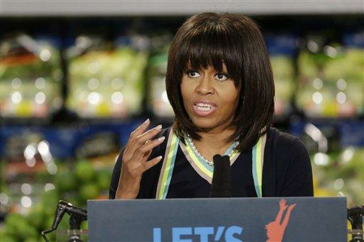 First lady Michelle Obama speaks to a small crowd at a Walmart Neighborhood Market in Springfield, Mo., Thursday, Feb. 28, 2013. (AP Photo/Orlin Wagner)
