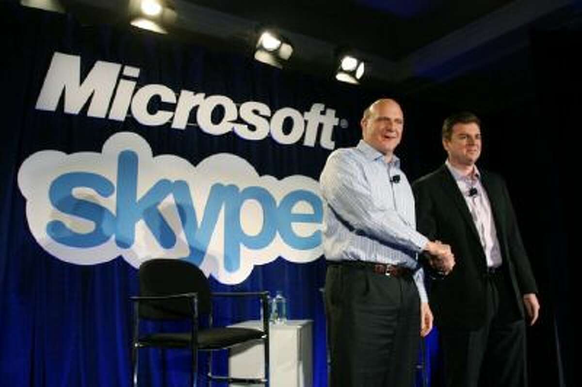 Microsoft CEO Steve Ballmer (L) shakes hands with Skype CEO Tony Bates during a news conference on May 10, 2011 in San Francisco, Calif. Microsoft has agreed to buy Skype for $8.5 billion.