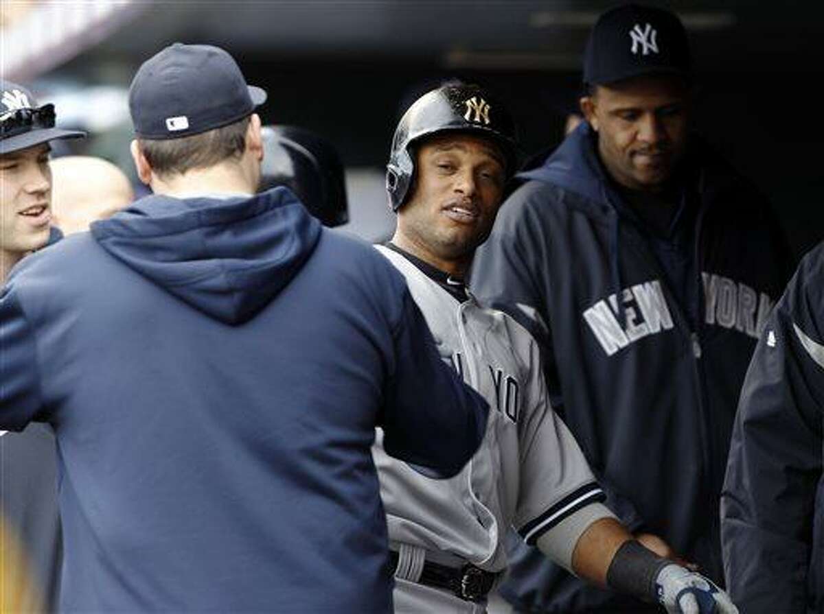 Cano helps Yankees to win over Rockies