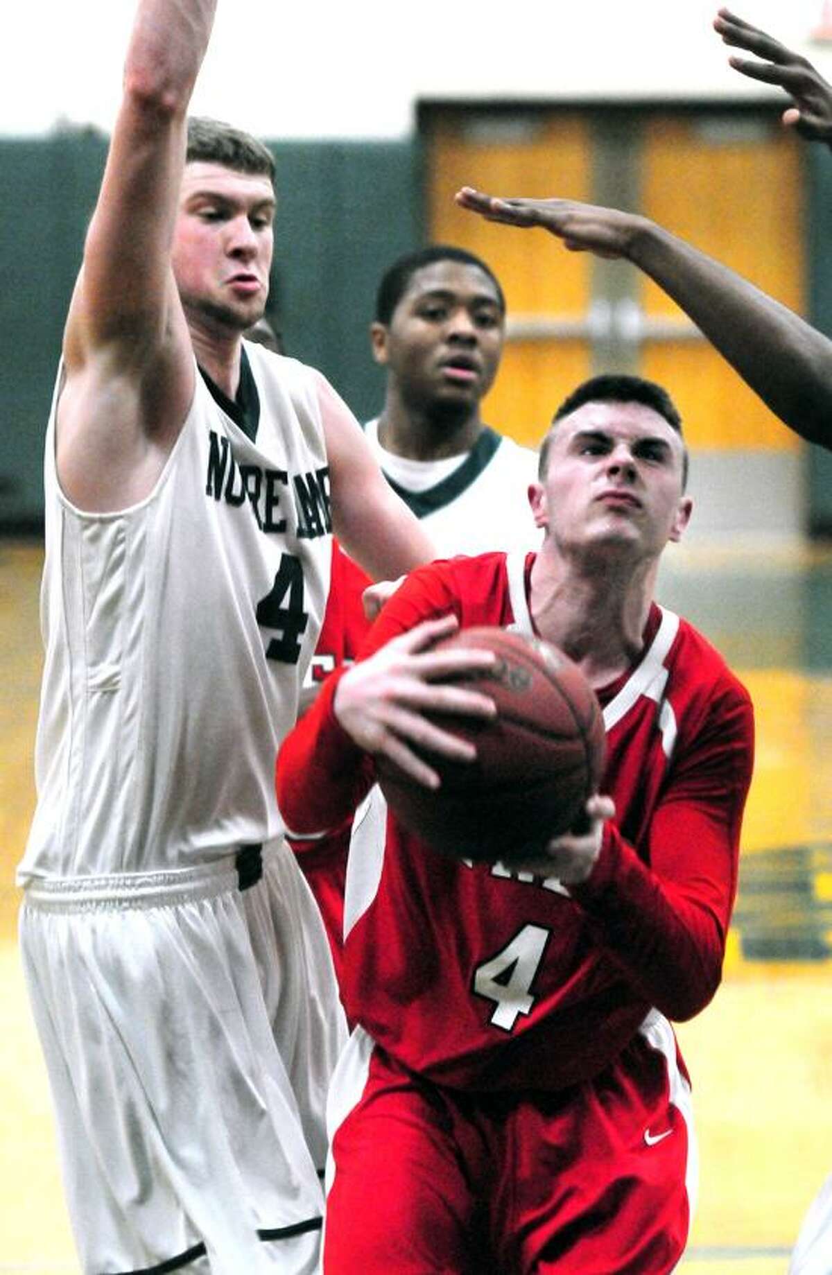 Ryan Murphy, right, of Fairfield Prep drives past Joseph Bongiorni from Notre Dame of West Haven. Murphy had 18 points in Prep's 74-57 win. Photo by Arnold Gold/New Haven Register.