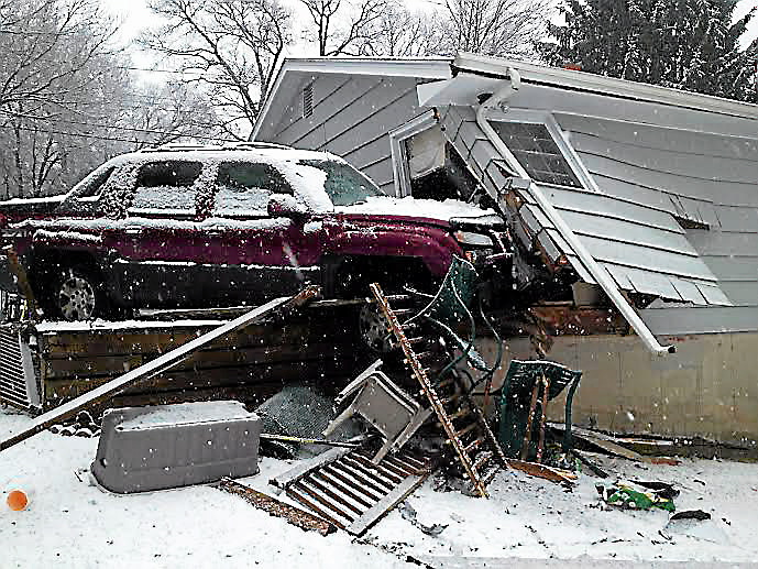 Car crashes into house on Sentinel Hill Road in Milford
