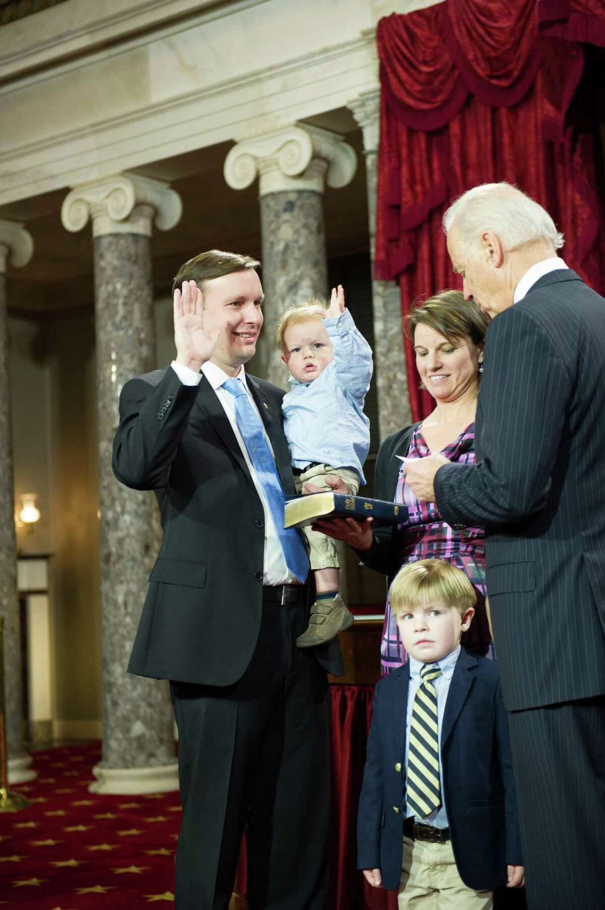 Connecticut's new U.S. Senator Murphy is sworn in with some help from his son Rider. With Murphy is Vice President Joe Biden, Cathy Holahan; and Owen Murphy, 4.(contributed photo)