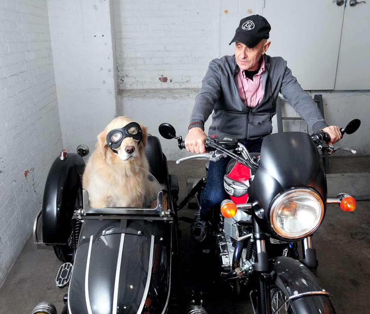 Danny Klein is photographed with his therapy dog, Remy, in a sidecar in the garage of their apartment building in New Haven on 2/14/2013.Photo by Arnold Gold/New Haven Register AG0483B