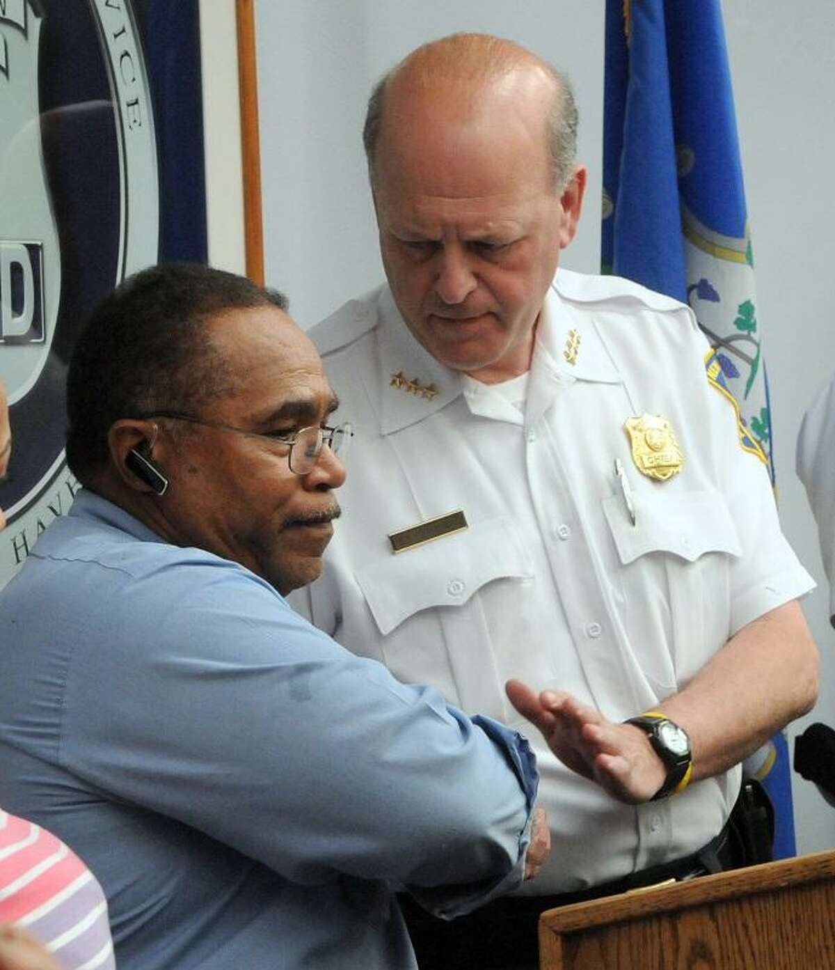 Hector Garcia, left, father of Christian Anderson Garcia who had been murdered on October 2012, shakes the hand of New Haven Policwe hief Dean M. Esserman after Garcia thanked the New Haven Police Department Tuesday, May 7, 2013 during a press conference at police headquarters for the arrest yesterday of Rashid Johnson who was charged with Garcia's murder. Photo by Peter Hvizdak / New Haven Register