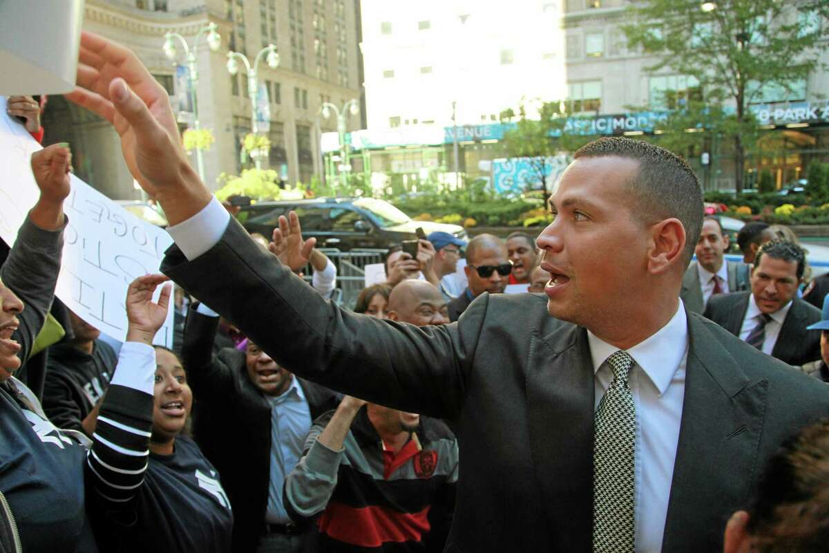 Alex Rodriguez arrives at the offices of Major League Baseball on Tuesday to appeal his 211-game suspension.