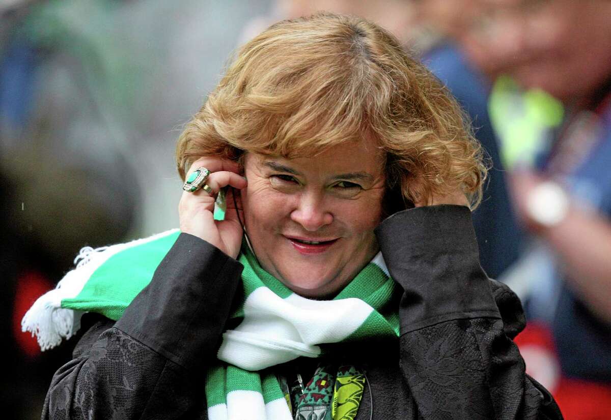 FILE - Susan Boyle performs ahead of the Champions League qualifying second round soccer match between Celtic and Helsingborgs at Celtic Park, Glasgow, Scotland, in this Aug. 29, 2012 file photo. Boyle told the Observer newspaper in an interview published Sunday Dec. 8, 2013, she has been diagnosed with Asperger's syndrome, a form of autism, after seeing a specialist a year ago. (AP Photo/Scott Heppell, File)