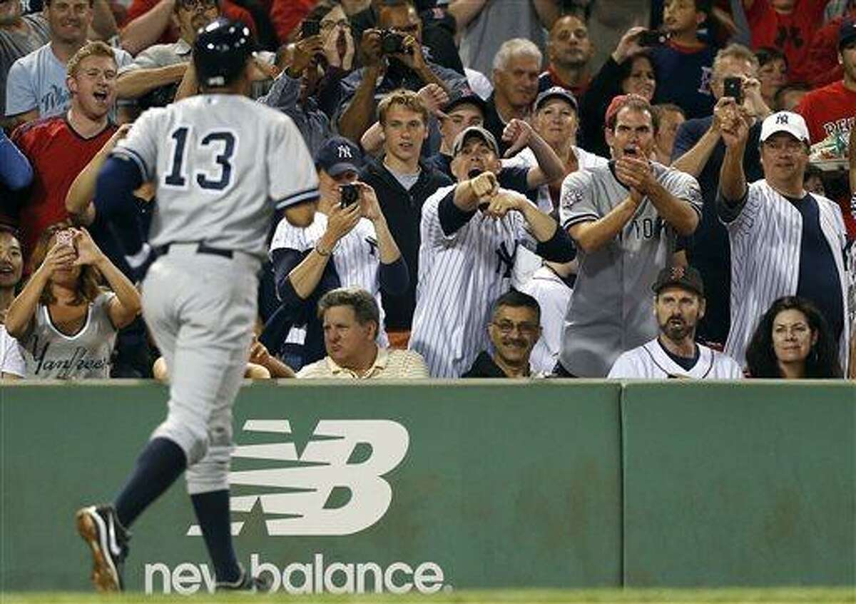 New York Yankees Derek Jeter reacts with Alex Rodriguez after