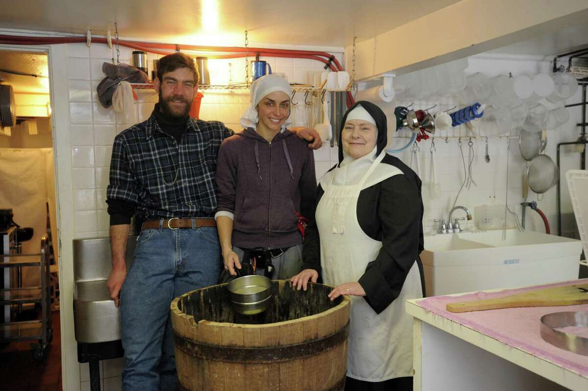 Sister Noella Marcellino, apprentice Stephanie Cassidy, and cheese maker Brother David Aeschliman.