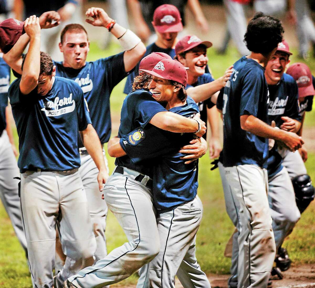 Branford celebrates its 12-2 win over Worcester, Mass., in the American Legion Northeast Regional championship game on Monday in Middletown.