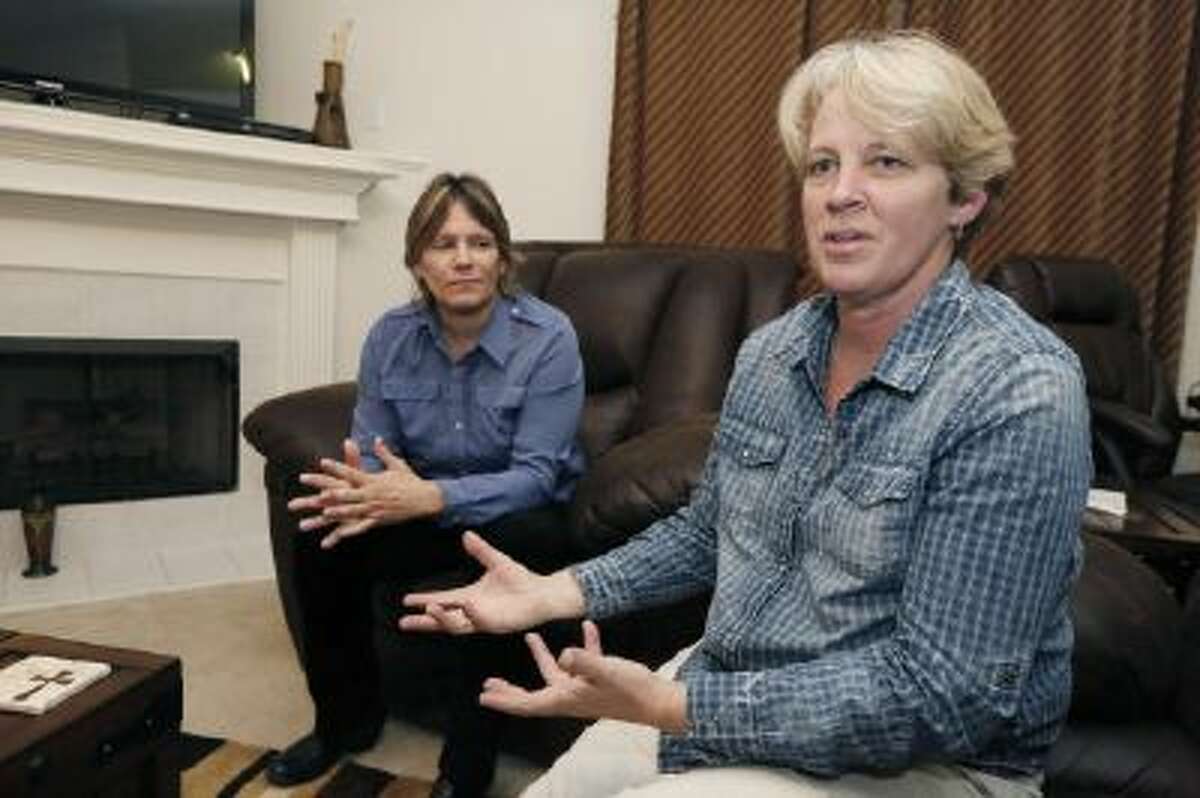 In this Nov. 5, 2013 photo, Dawn Jefferies, right, speaks in Hernando, Miss., about the efforts Lauren Beth Czekala-Chatham, left, has taken to get the state to recognize a same-sex marriage performed in California, so Czekala-Chatham can now divorce that partner she lived with as a couple in DeSoto County, until they separated in 2010.