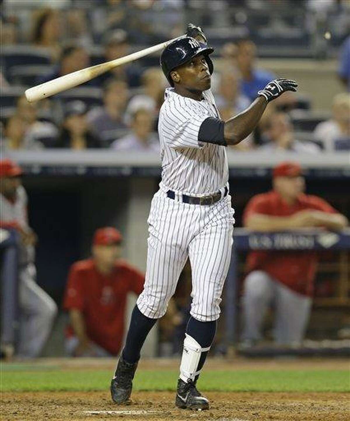 New York Yankees Alfonso Soriano follows through after hitting a seventh-inning, three-run home run in a baseball game against the Los Angeles Angels, Tuesday, Aug. 13, 2013, in New York. It was Soriano's second home run of the game. He also hit a fifth-inning, two-run home run. (AP Photo/Kathy Willens)