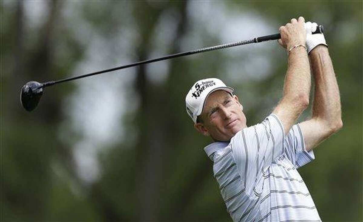 Jim Furyk watches his tee shot on the ninth hole during the first round of the PGA Championship golf tournament at Oak Hill Country Club, Thursday, Aug. 8, 2013, in Pittsford, N.Y. (AP Photo/Charlie Neibergall)