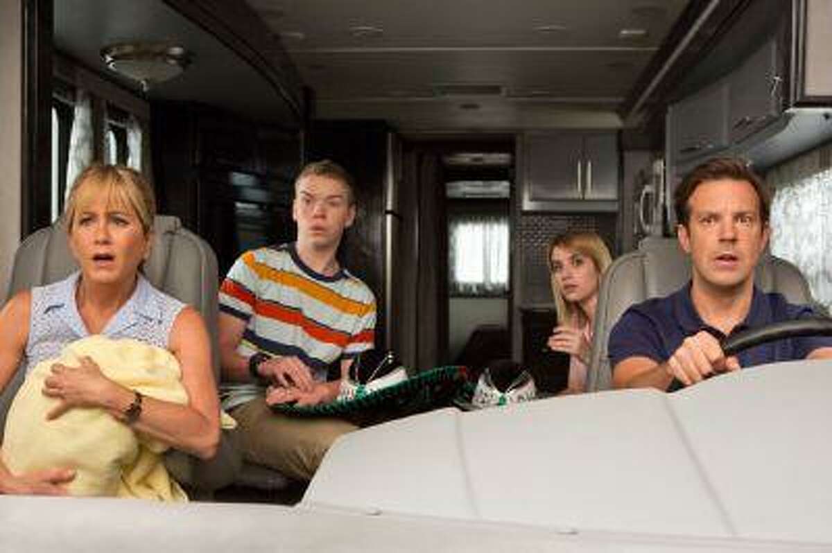 This film image released by Warner Bros. Entertainment shows, from left, Jennifer Aniston, Will Poulter, Emma Roberts, and Jason Sudeikis in a scene from "We're the Millers." (AP Photo/Warner Bros. Entertainment, Michael Tackett)